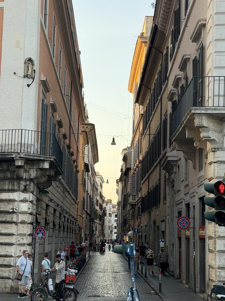 A narrow Roman street at dusk