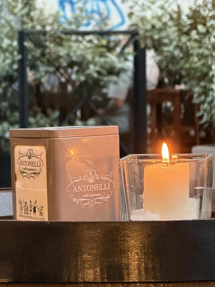 A candle on a café table